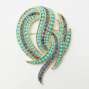 Vintage gold tone faux turquoise blue crystals swirl brooch pin crown Trifari